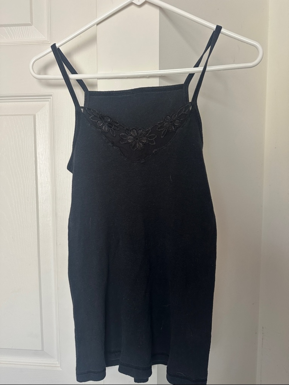 Black tank top with floral lace accent